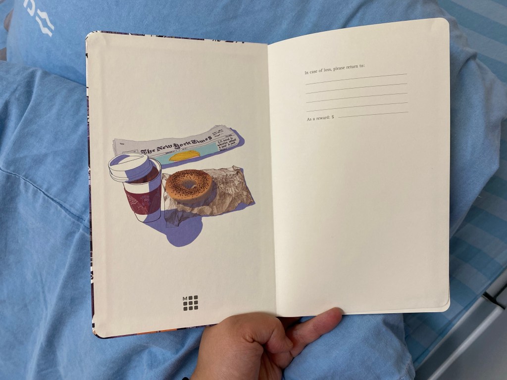 Front endpaper which features the New York Times, a take away coffee and a bagel on a brown paper bag. Remember the bagel, we'll be returning to that later on. 