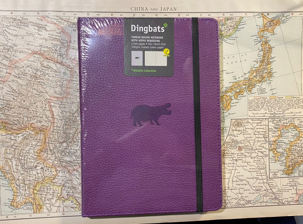 Purple front cover with hippo debossing.